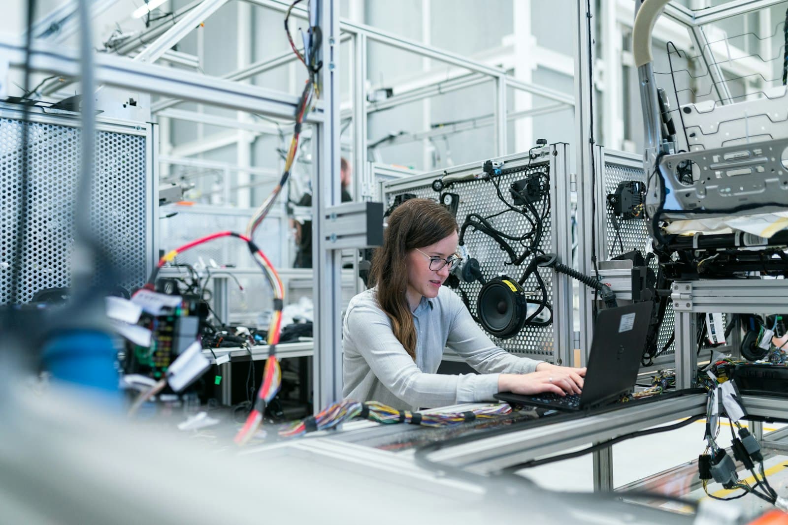 Technician working on an automated factory production line